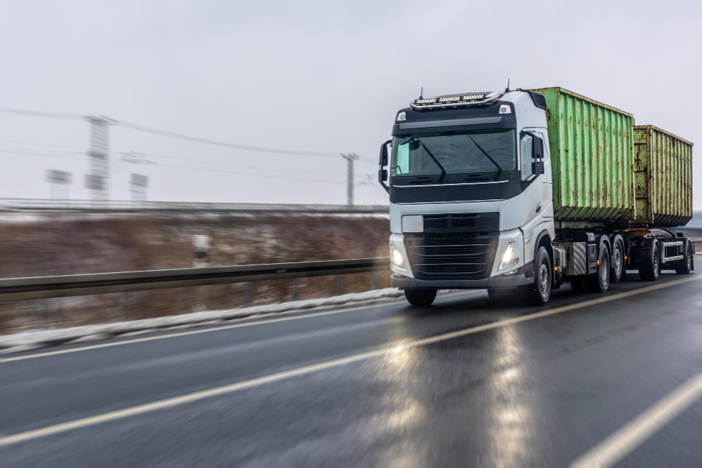 Road freight forwarding truck transporting goods across Dubai